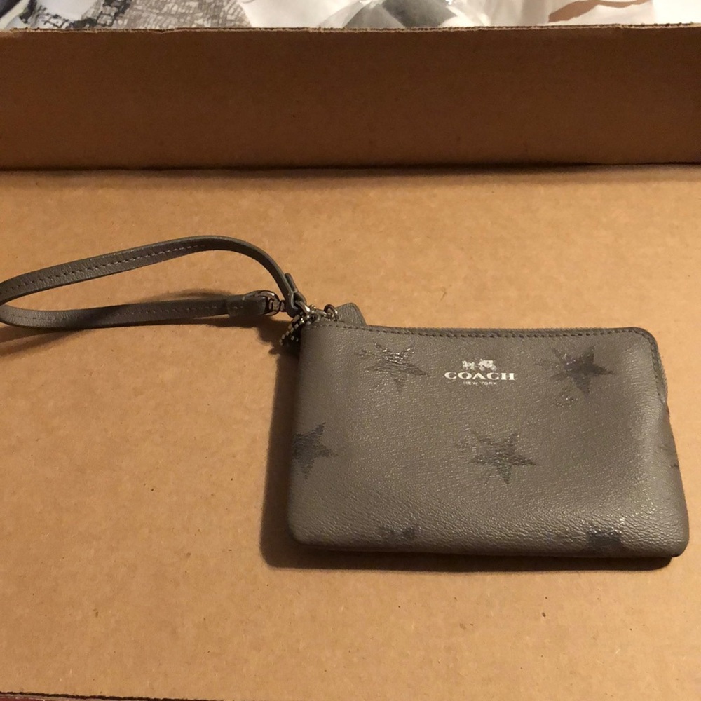 Silver coach wristlet with stars